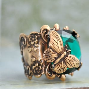 BUTTERFLY IN MOTION Neo Victorian vintage style brass ring with butterfly and Swarovski Emerald green glass cab image 1