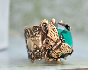 BUTTERFLY IN MOTION Neo Victorian vintage style brass ring with butterfly and Swarovski Emerald green glass cab