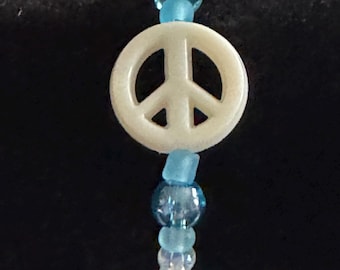 Unieke kralenarmband met vredesteken