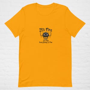 Unisex t-shirt A funny fictional cartoon character to express feelings of stress and exhaustion in a fun way saying Its fine I am fine