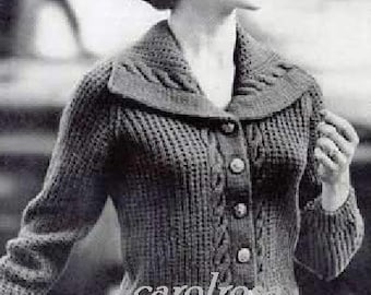 May include: A black and white photo of a woman wearing a knitted cardigan with a cable knit pattern and a large collar. The cardigan has five buttons down the front.