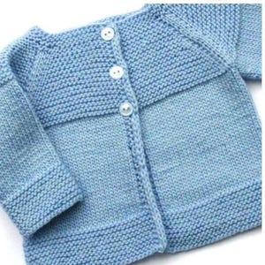 May include: A light blue knitted baby cardigan with button closures.