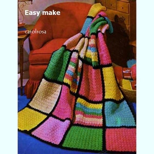 May include: A colourful crochet blanket with squares in shades of pink, green, yellow, and blue. The blanket is draped over a red armchair. The text "Easy make" and "carolrosa" is visible in the image.