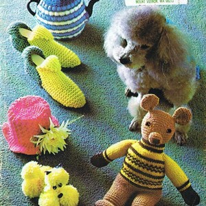 May include: A collection of knitted items including a teapot cosy, slippers, a hat, a teddy bear, and a poodle. The items are all made in different colours and patterns.