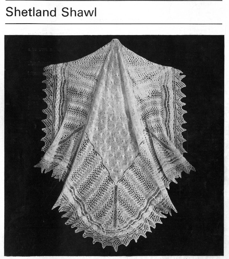 May include: A white crocheted Shetland shawl with a delicate lace pattern.