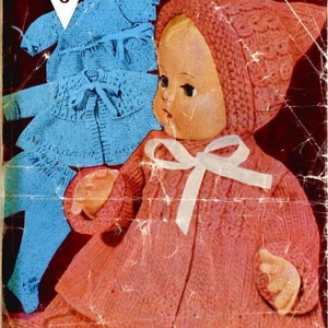 May include: A knitting pattern for a doll's outfit. The pattern includes instructions for a pink knitted dress, a matching hat, and blue knitted booties. The pattern is for a 16-inch doll and requires 7 ounces of yarn.