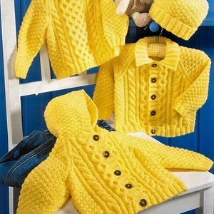 May include: Three yellow knitted sweaters for babies, one with a hood, one with a button-up front, and one with a crew neck. A yellow knitted hat with a pom-pom is also included.
