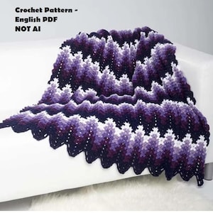 May include: A crochet blanket featuring a chevron pattern in shades of dark purple, light purple, and white. The text "Crochet Pattern - English PDF NOT AI" is printed in the upper left corner. The blanket has a scalloped edge and a textured finish.