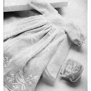 May include: A white crocheted baby dress with a matching bonnet. The dress has a delicate lace pattern and a gathered skirt.