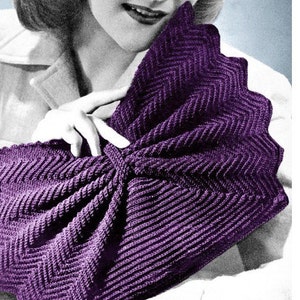 May include: A purple crocheted clutch bag with a chevron pattern and a bow detail.