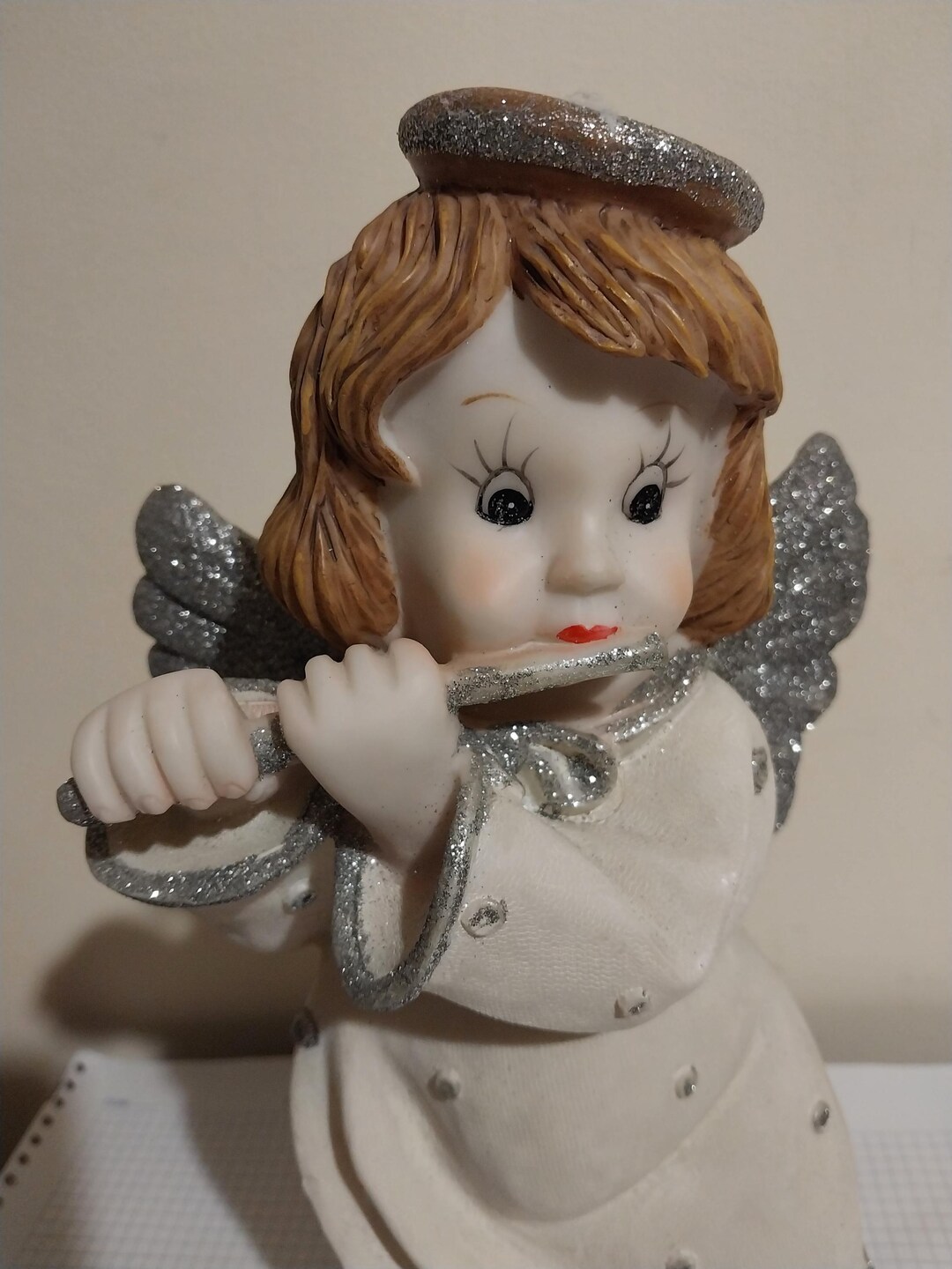 A Flute-playing Angel Figurine is a Common Decorative Item, Often Used ...
