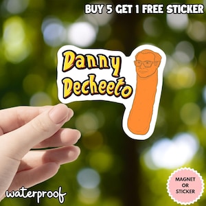 May include: A waterproof sticker with the text "Danny Decheeto" in yellow and red, featuring an illustration of a person's face on a Cheeto. The sticker is designed to be a magnet or sticker.