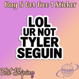 May include: A white sticker with black text that reads "LOL UR NOT TYLER SEGUIN" on a gradient purple and orange background. The sticker is a humorous statement. The image also includes the text "Buy 5 Get free 1 Sticker".