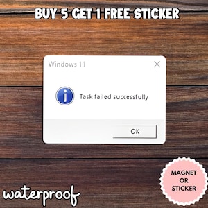 May include: A white sticker with the text "Windows 11" and a pop-up message that reads "Task failed successfully." The sticker also has the text "waterproof" and "MAGNET OR STICKER."