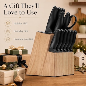 May include: A set of black kitchen knives stored in a light-colored wooden block. The text "A Gift They'll Love to Use" is visible, along with icons and labels for "Holiday Gift," "Birthday Gift," and "Housewarming Gift" next to the knife block.