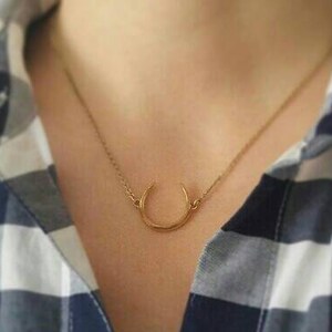 Gold Horseshoe Necklace Upside Down 
