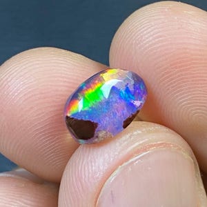 2.70 carats. Cabochon mexican water opal with its beautiful colors AAA Quality. measure 11X6X6 mm