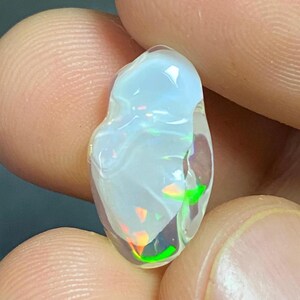 Amazing water opal with its beautiful rain flashes and quarry inlays AAA quality. Weight 5.00 carats Measures 18X10X6 mm