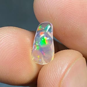 Amazing water opal with its beautiful rain flashes and quarry inlays AAA quality. Weight 2.20 carats Measures 9X8X5 mm