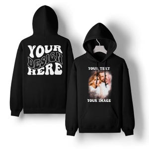 May include: Black hoodie with a front pocket and a hood. The front of the hoodie displays a photo of a couple with the text "YOUR TEXT" and "YOUR IMAGE". The back of the hoodie has the text "YOUR DESIGN HERE" in white.