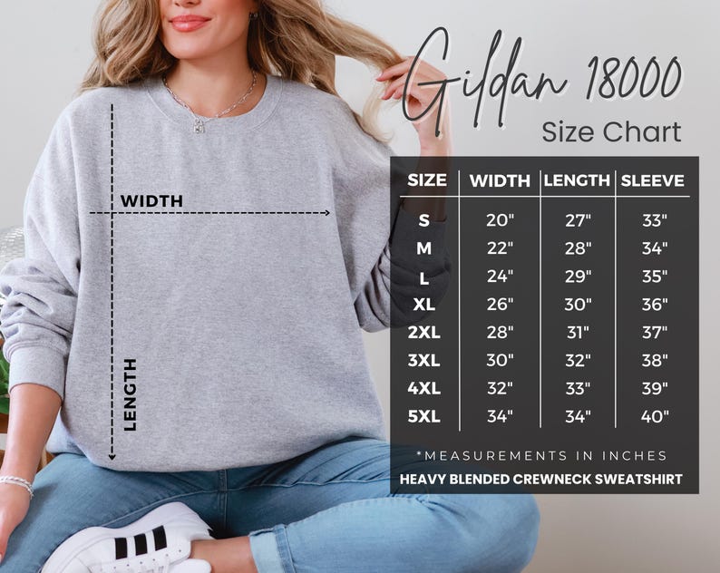 a woman wearing a gray crew neck sweatshirt, with a size chart displayed next to her.
