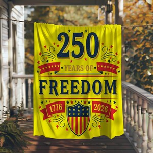A yellow banner with the text "250 YEARS OF FREEDOM" and a shield design, hanging on a porch.