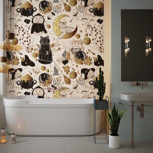 May include: A contemporary bathroom featuring a white bathtub and a wallpaper with a pattern of cats, moons, and celestial motifs. The room includes a mirror, sink, and plants, creating a whimsical and stylish space.