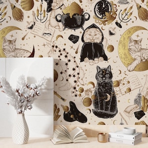 May include: A cream-coloured background with a repeating pattern of cats, moons, and stars in gold and black. The image includes a black cat with a crescent moon, a cat in a black cloak, and a white vase with cotton stems.