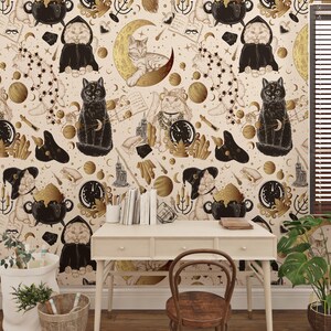 May include: A patterned wallpaper design with a repeating motif of cats, moons, stars, and magical elements in beige, black, and gold. The design includes cats in cloaks, cauldrons, and celestial motifs, creating a mystical theme.