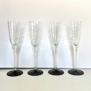 Four 1980&#39;s Optic Swirl Clear and Black Crystal Champagne Flutes