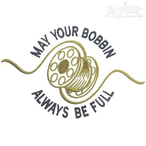 May include: Embroidered design of a bobbin with thread, with the text "May your bobbin always be full".