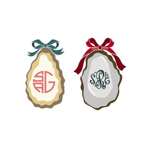 May include: Two oyster shell designs with personalized monograms. One shell has a teal bow and a red and pink monogram. The other shell has a red bow and a dark green monogram. Both shells have a white interior and a brown border.