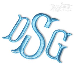 May include: A blue embroidered monogram with the letters "DSG" in a cursive font.