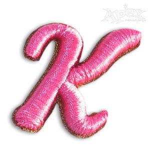 May include: Pink embroidered letter K with a gold outline. The letter is in a cursive font.
