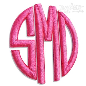 May include: A pink monogram with the letters "SMD" in a circle.