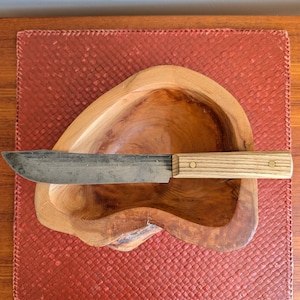 May include: A set of three ceramic mugs with a speckled, matte finish. The mugs are in shades of cream, light gray, and dark gray. Each mug has a simple, minimalist design, perfect for coffee or tea.