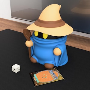 May include: A set of three ceramic mugs with a speckled, cream-colored glaze. Each mug features a different hand-painted design: a blue and green leaf, a yellow flower, and a red berry. The mugs have a simple, rounded shape.