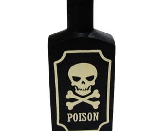 May include: Black bottle with a white skull and crossbones label that reads "POISON". The bottle has a rectangular shape with a rounded top and a white rim. A Halloween-themed decorative item.