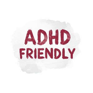 May include: The words "ADHD FRIENDLY" in a deep red, handwritten-style font are centered on a white watercolor-style background. The background has soft, gray-toned edges, creating a subtle, artistic effect. The overall design is simple and direct.