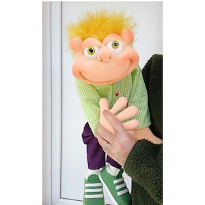 May include: A set of three ceramic mugs with a speckled, matte finish. Each mug features a different color: light blue, cream, and gray. The mugs have a simple, modern design, perfect for coffee or tea.