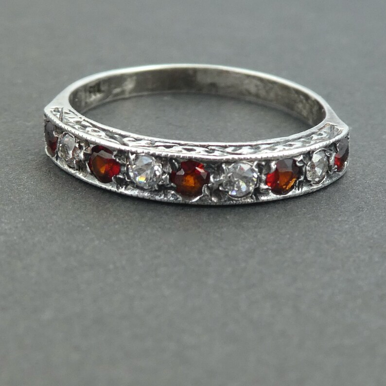 A garnet and paste silver ring