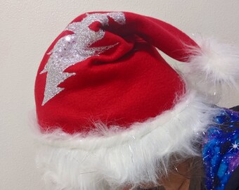 Cozy Fleece Santa Hat with Sparkle Sequin 13 Point Lightning Bolt, White Faux Fur Trim and Silver Tinsel Puff Ball
