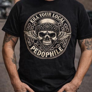 May include: Black t-shirt featuring a circular graphic with a skull wearing a bandana and wings, with the text "KILL YOUR LOCAL PEDOPHILE". The design is in a vintage style.