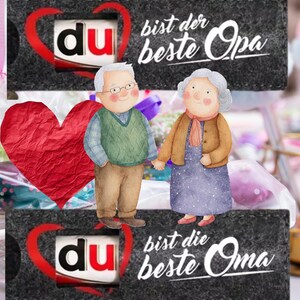 May include: A gift box with a watercolor illustration of an elderly couple holding hands. The box has the text "du" inside a red heart, and the words "bist der beste Opa" and "bist die beste Oma" in white script.