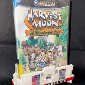 UNIVERSAL THEATER Currently Playing Video Game/DVD Stand
