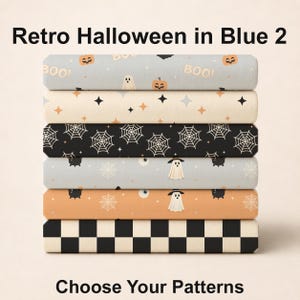 May include: A stack of six folded fabric bolts featuring Halloween patterns. The designs include orange pumpkins, ghosts, and the text BOO on light blue, star patterns on cream, white spiderwebs on black, ghosts and cauldrons on light blue and orange, and a black and white checkerboard pattern.