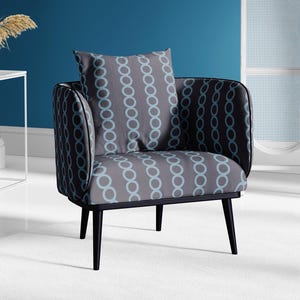 May include: A gray armchair with black legs and a blue and gray patterned cushion. The chair has a rounded back and a slightly curved seat.