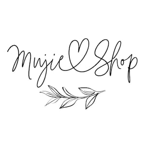 May include: A black and white logo with the text "Mujie Shop" in a cursive font, with a heart replacing the "o" in "Mujie". Below the text is a sprig of leaves.