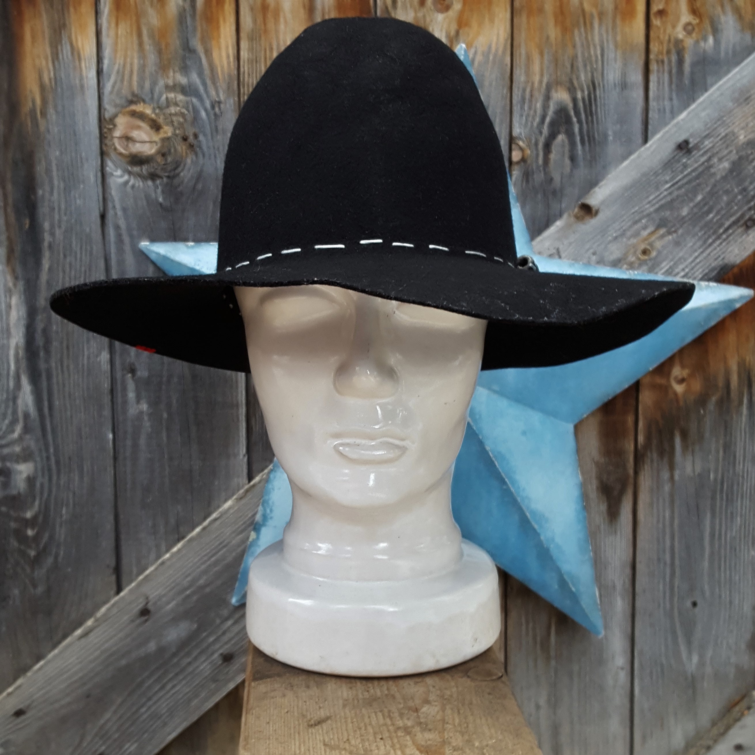 Distressed Black Felt Western Hat hand 