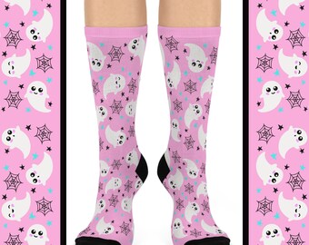 May include: Pink socks with a pattern of white ghosts, black spiderwebs, and blue stars.